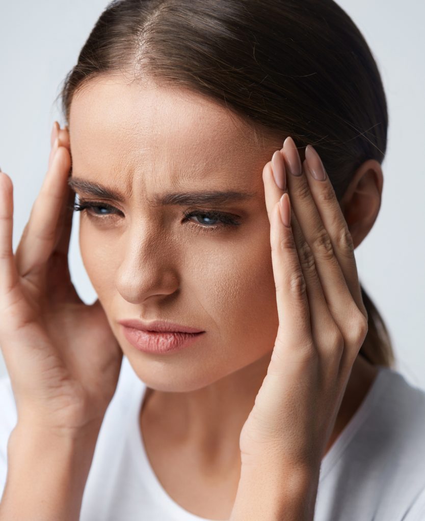 Young woman with a headache