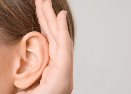 Woman suffering from tinnitus