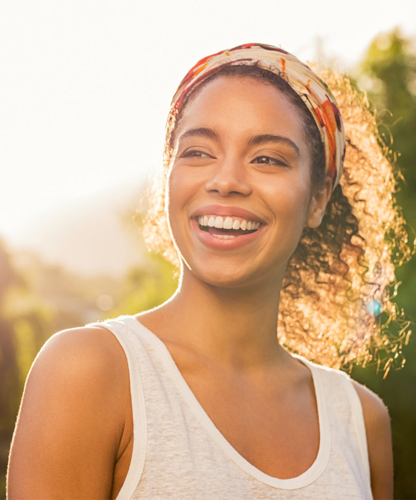 Smiling woman with full facial volume